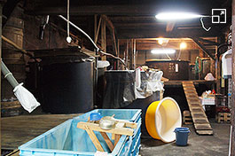 The mashing room has a historical atmosphere.